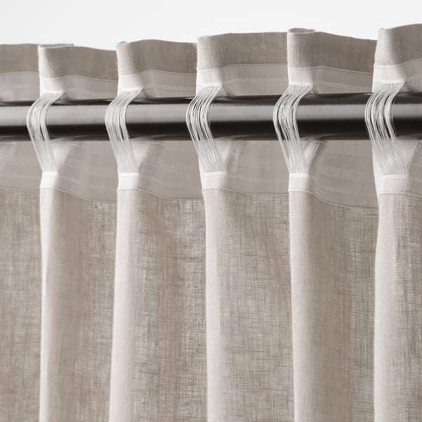 Light filtering curtains with heading tape for easy hang.