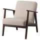 Ekenaset armchair in beige fabric. Mid-century design with wooden legs and arms. Comfortable, retro style.