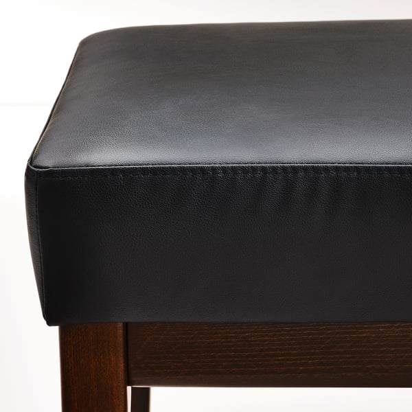 Close-up of stylish black cushioned bench with wooden legs, showcasing high-quality upholstery and sturdy design.