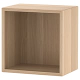 An ikea EKET cube shelf. It is light brown, square-shaped, and made of particle board with a simple design.
