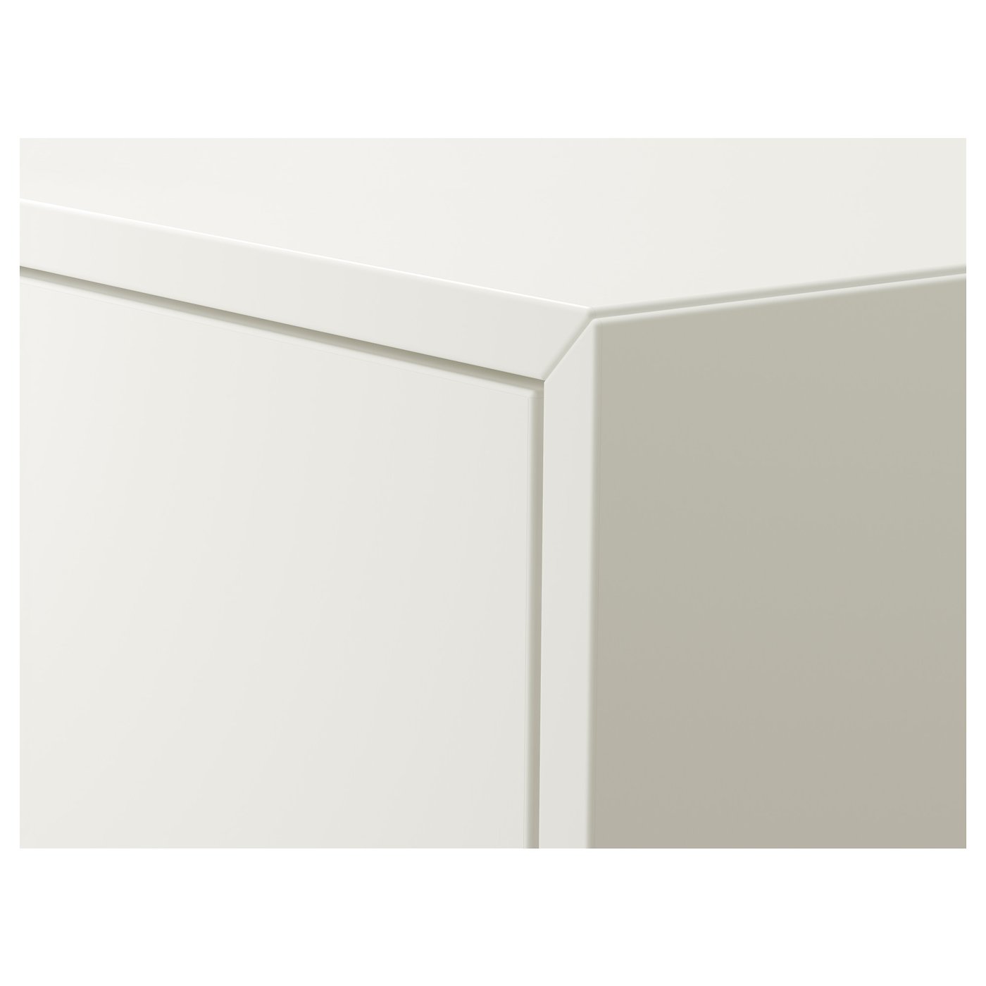 Modern white cabinet with sleek, clean lines. Hidden hinges and smooth surfaces, indicating high-quality craftsmanship.