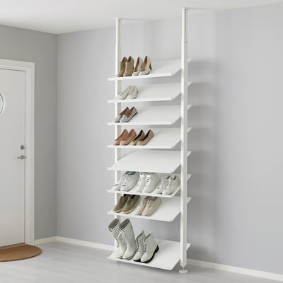 White ELVARLI shoe rack, storing various footwear on adjustable shelves against a grey wall.