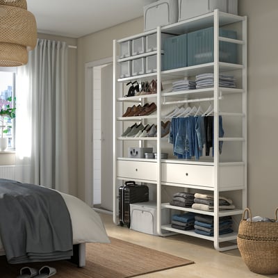 A tidy bedroom with ELVARLI storage, bed, and wicker pendant light.