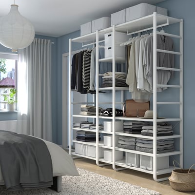 ELVARLI white storage in bedroom, with shelves and hanging rails for clothes.