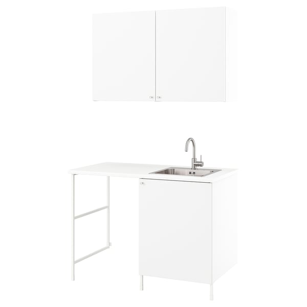 White ENHET laundry unit with cabinets, countertop, sink, and faucet.