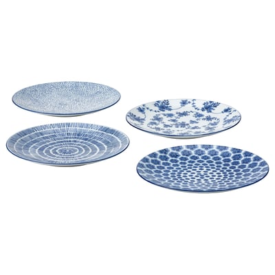 Four blue and white patterned plates, square arrangement: floral, geometric, swirls. Feldspar porcelain, round shape.
