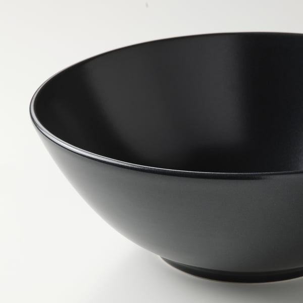 Black bowl, matte finish, glossy rim, on white.