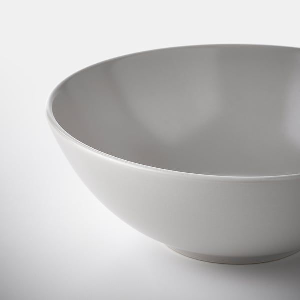 Smooth, modern bowl with sleek, grey interior and exterior. Made of sturdy stoneware, ideal for various meals.