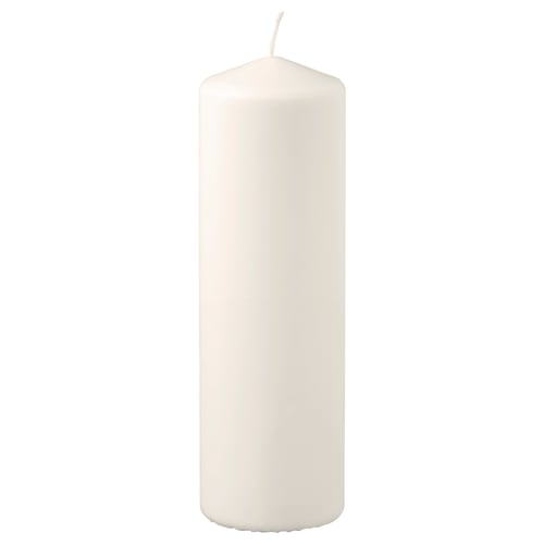 White FENOMEN candle, cylindrical shape, made of plant-based wax and cotton wick.