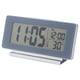 A FILMIS digital clock in silver with led backlight, displaying time, alarm, and temperature.