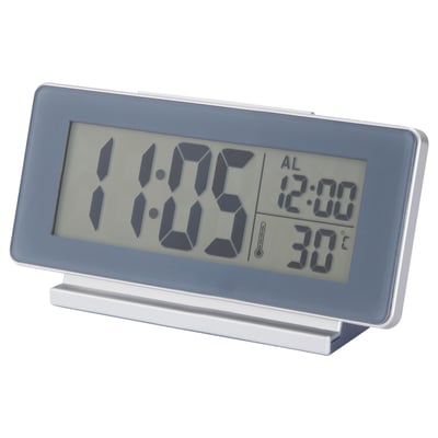 A FILMIS digital clock in silver with led backlight, displaying time, alarm, and temperature.