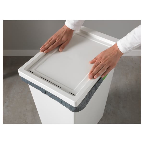 Person opening large FILUR storage bin with lid.