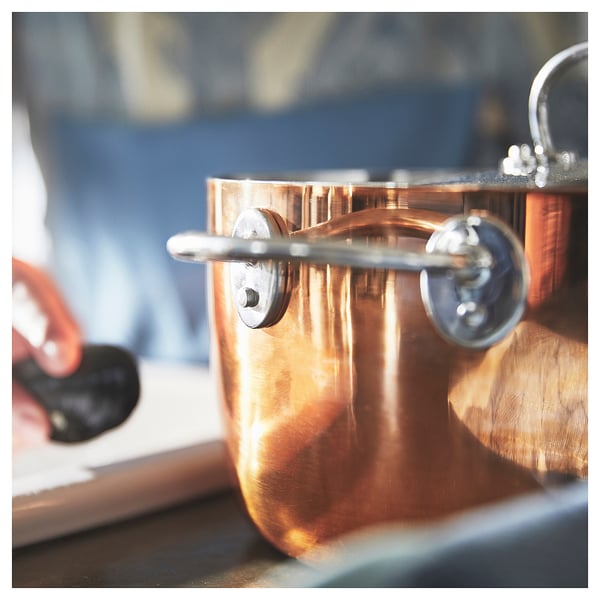 FINMAT pots shiny copper body, stainless steel lid & handles, induction hob compatible. Designed by ilse crawford for an elegant, efficient kitchen.