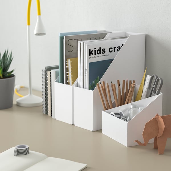 FJÄDERHARV white desk organiser with 4 compartments holds pens, scissors, and books. Compact yet spacious, fits neatly among other desk items.