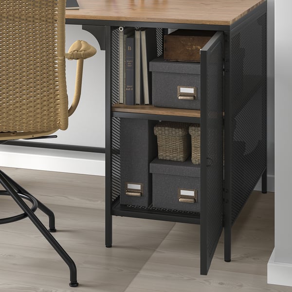 Modern desk with open storage, grey boxes, wicker baskets, and books. Industrial and rustic design.