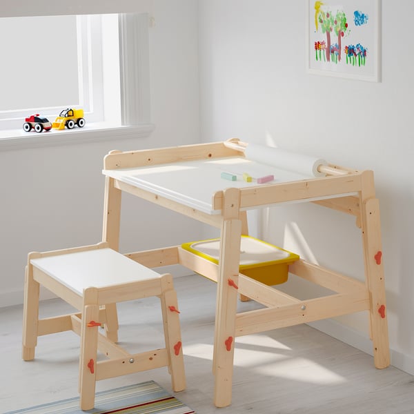 FLISAT: wooden kids bench and table set, natural finish, square shape, adjustable height, small compared to surrounding items.