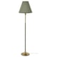 Green-finished metal floor lamp with brass accents and conical shade.