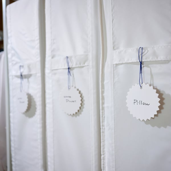 Labels on fabric with elastic, erasable text for easy item organisation.