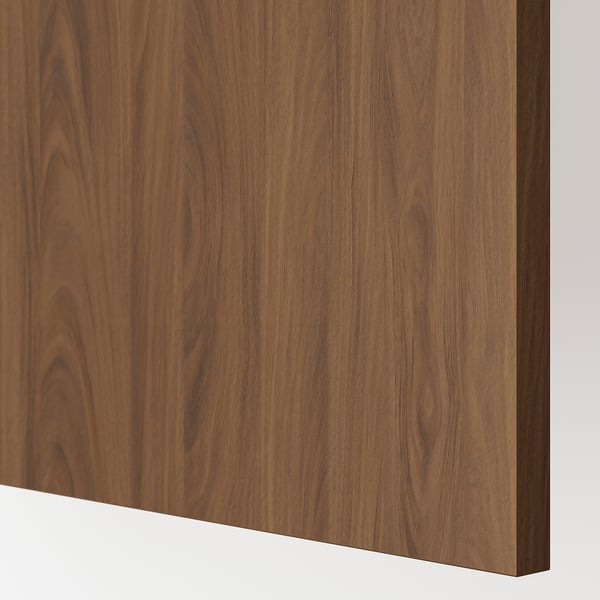 Close-up of smooth walnut panel, showcasing rich grain texture and polished finish.