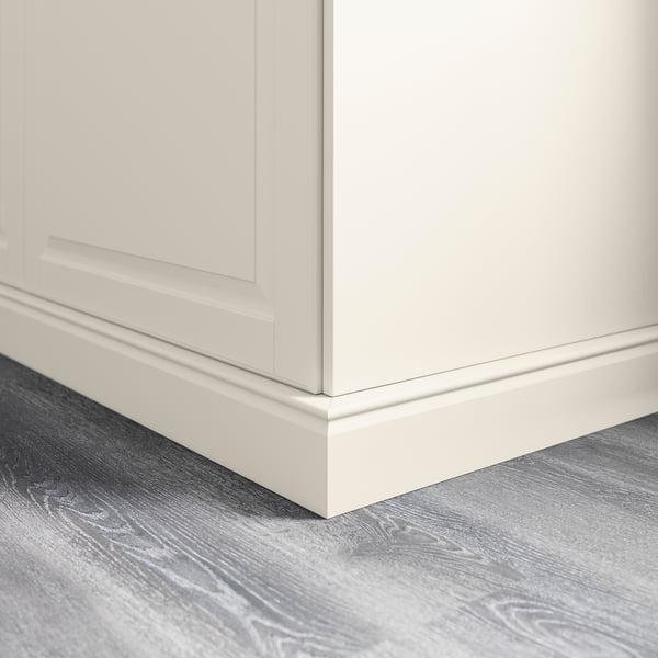 White kitchen cabinet plinth covering floor gap.