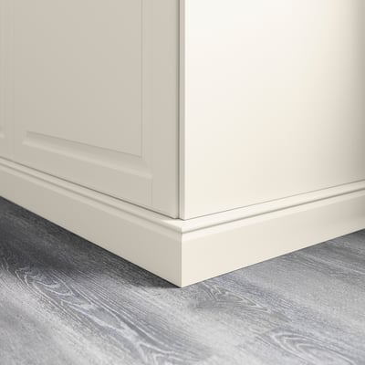 White kitchen cabinet plinth covering floor gap.