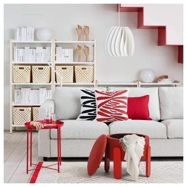 Modern living room with grey FÖRLUNDA sofa, red accents, and minimal decor.