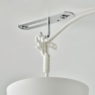 Silver ceiling hook with white cable, attaching lamp to ceiling.