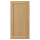A FORSBACKA cabinet door in warm oak veneer featuring a classic, framed design with bevelled edges.