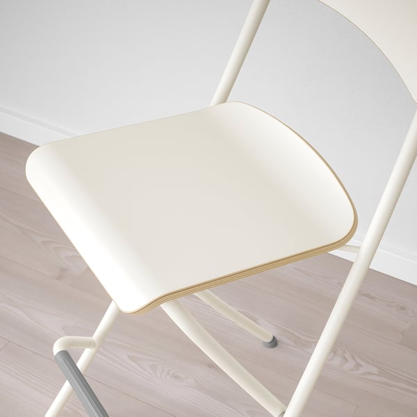Modern white bar stool with sleek design and sturdy steel frame, ready for use.