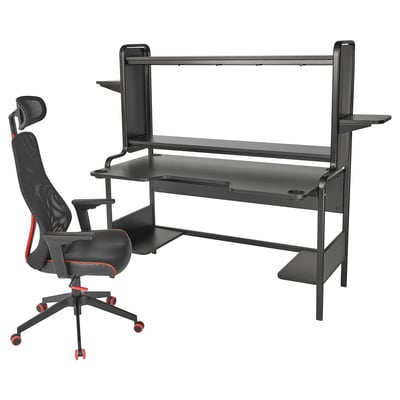 Black gaming desk and chair. Desk has shelves, cup holders. Chair has mesh back, adjustable armrests, and headrest.