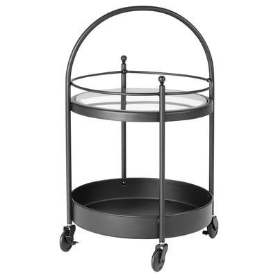 Black metal bathroom trolley with glass top shelf and deep bottom tray, on wheels with handle.