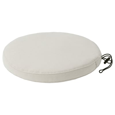 Round white outdoor seat cushion with secure ties.