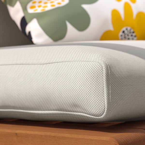 Close-up of a comfortable, outdoor seat cushion with grey mesh material, designed for durability.