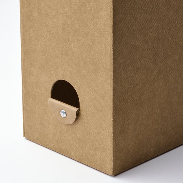 Brown cardboard magazine file with semi-circular handle and metal fastener, standing upright.