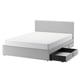 Modern white bed with grey headboard, storage drawers, sleek design.