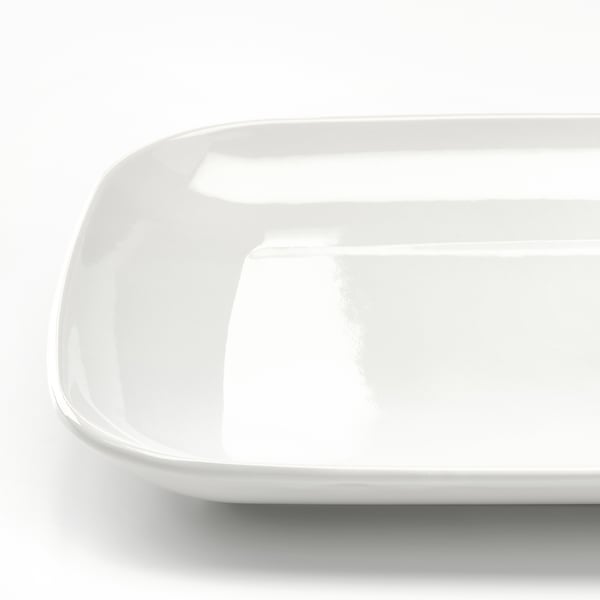 Smooth, shiny white dinnerware; rectangular plate in pristine condition.