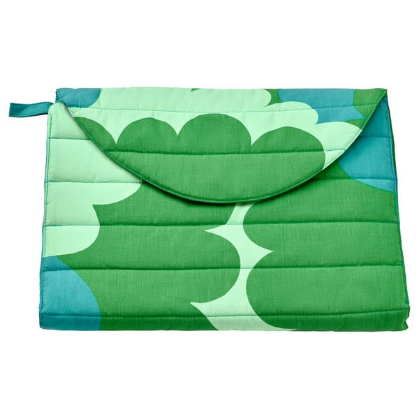 Foldable green patterned baby changing mat with teal accents, featuring pockets and a removable cover.