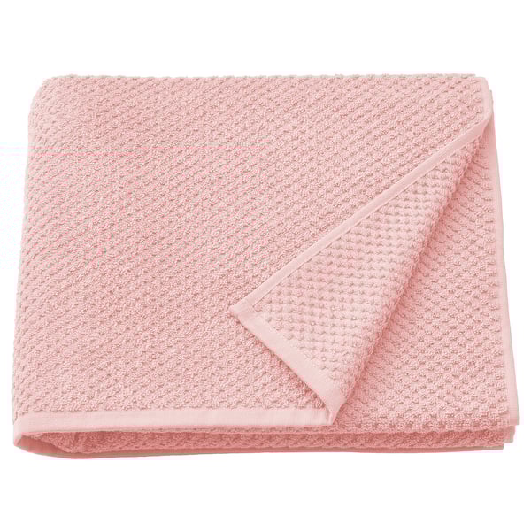 Folded light pink GULVIAL towel, soft 100% cotton, textured weave design.
