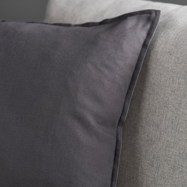 Dark grey cushion cover, smooth texture, quality fabric, zip detail.