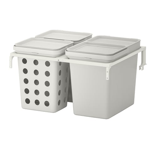 Two white waste sorting bins, one with holes, mounted side by side on a support frame.