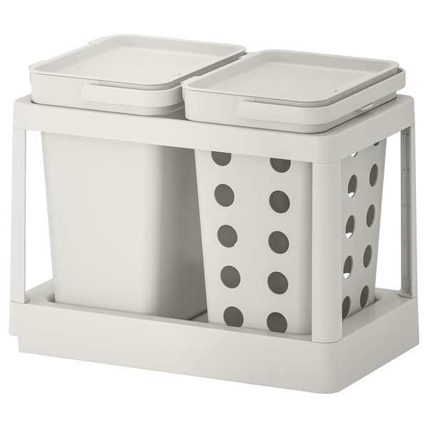A white HÅLLBAR dual waste sorting bin with lids. It has ventilation holes and a foldable handle.