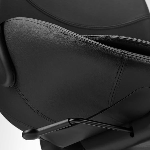 Black ergonomic office chair with lumbar support.