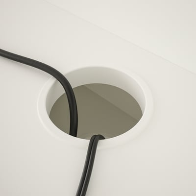 Desk with built-in cable management, keeping cords tidy and accessible.