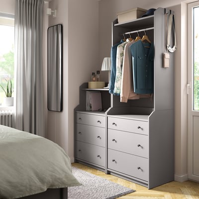 Grey HAUGA bedroom furniture. Chest, wardrobe, and bedding.