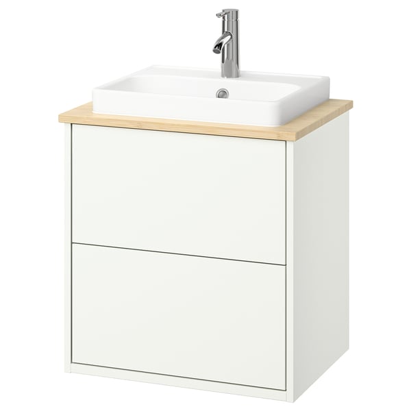 Modern white bathroom cabinet with light wood counter, rectangular sink, chrome tap.