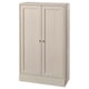 A HAVSTA wooden cabinet in a light beige colour, featuring two doors with a rustic design and a soft-close function.