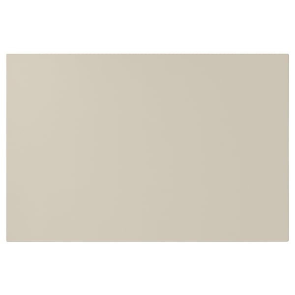 A beige HAVSTORP rectangular kitchen cabinet door made from acrylic-painted fiberboard, with smooth edges.