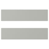 Two modern, light grey, rectangular cabinets with smooth surfaces and straight edges.