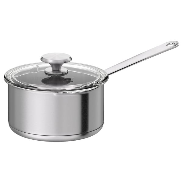 A stainless steel saucepan with a glass lid and built-in strainer, featuring a long handle for easy pouring.