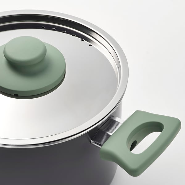 Modern saucepot with green handle and lid.